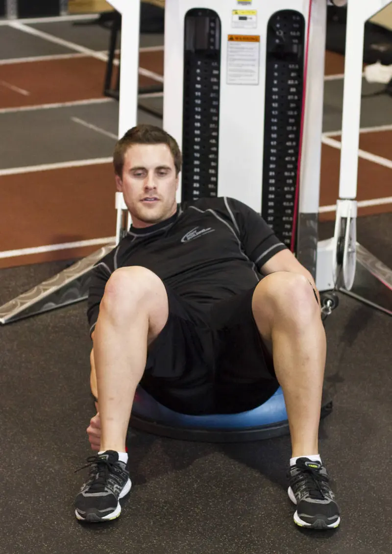 Bosu Ball Cable Crunch With Side Bends — finish position