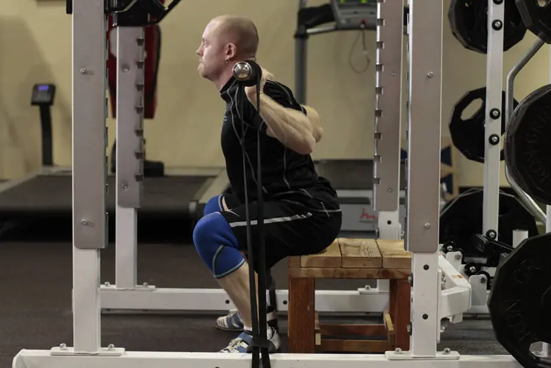 Box Squat with Bands — finish position