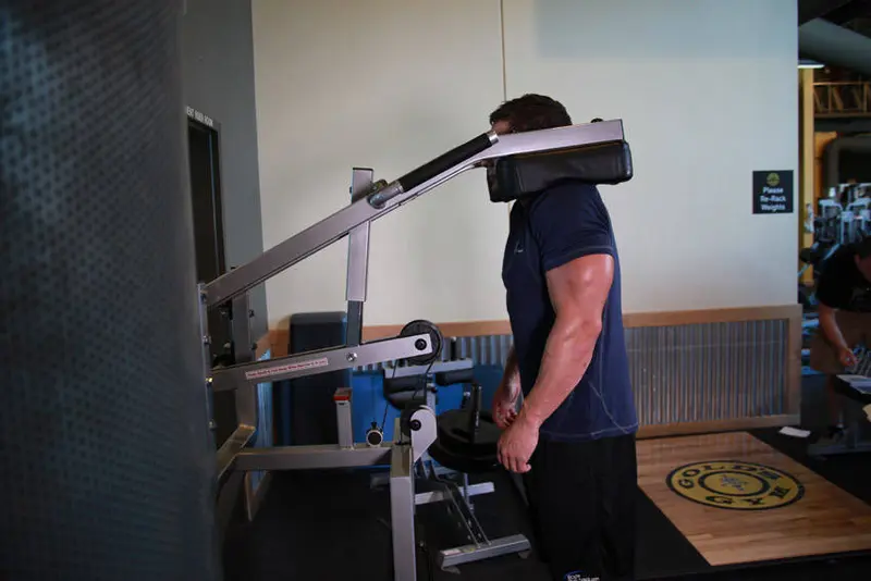Calf-Machine Shoulder Shrug — finish position
