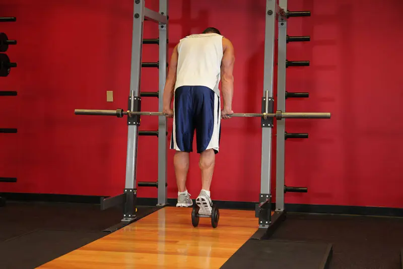 Calf Raise On A Dumbbell — finish position