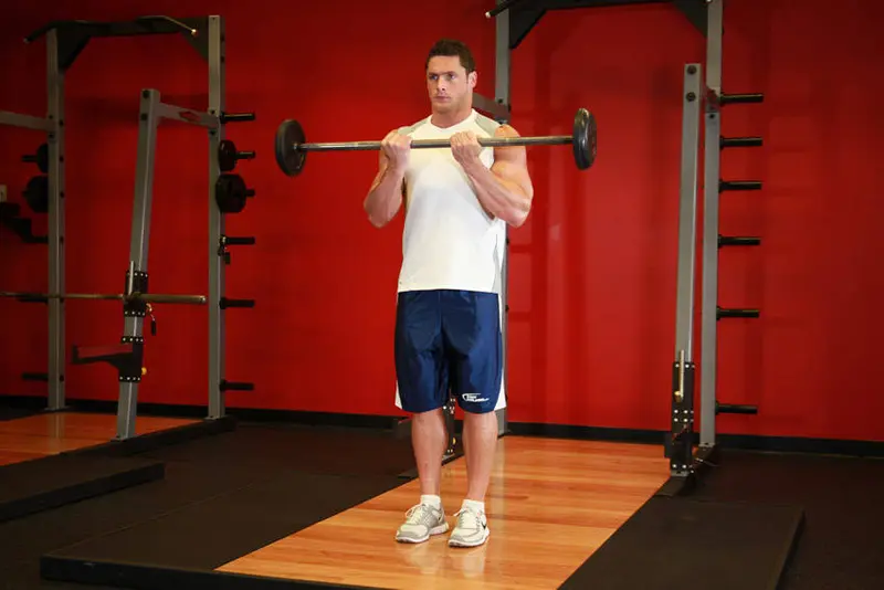 Close-Grip Standing Barbell Curl — finish position