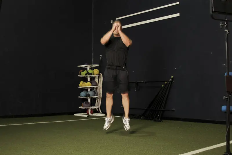 Double Leg Butt Kick — finish position