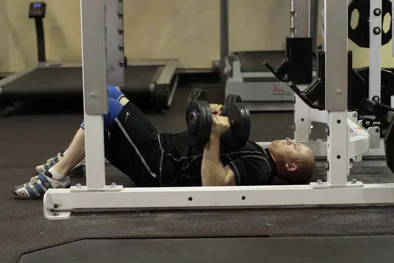 Dumbbell Floor Press — finish position