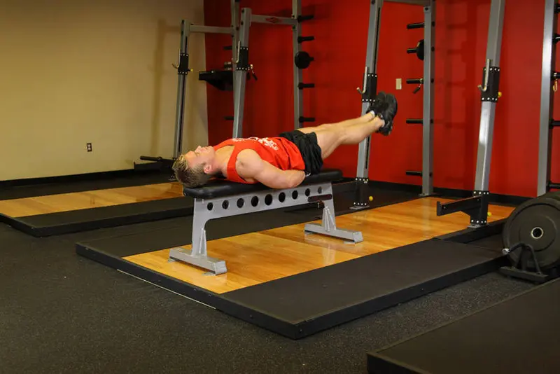 Flat Bench Leg Pull-In — finish position