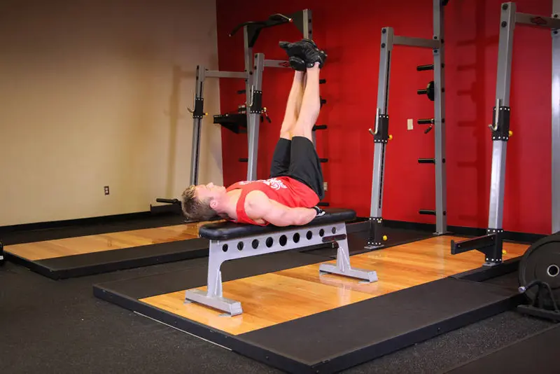 Flat Bench Lying Leg Raise — finish position