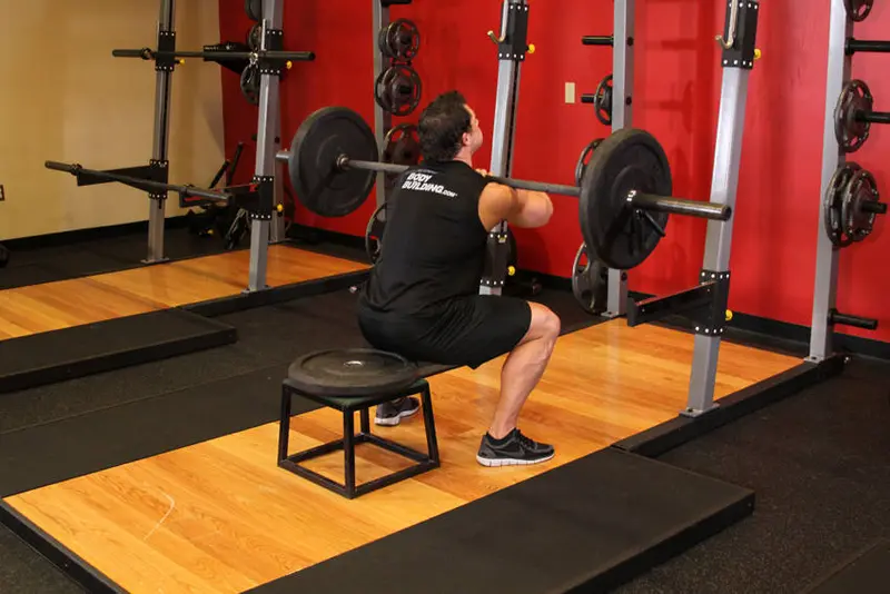 Front Barbell Squat To A Bench — finish position