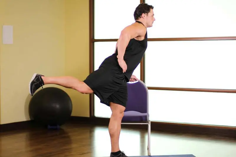 Front Leg Raises — finish position