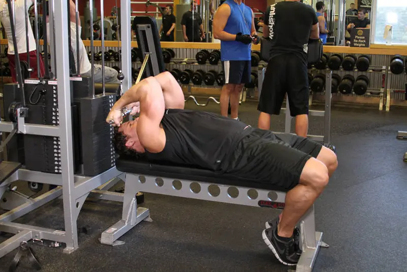 High Cable Curls — finish position