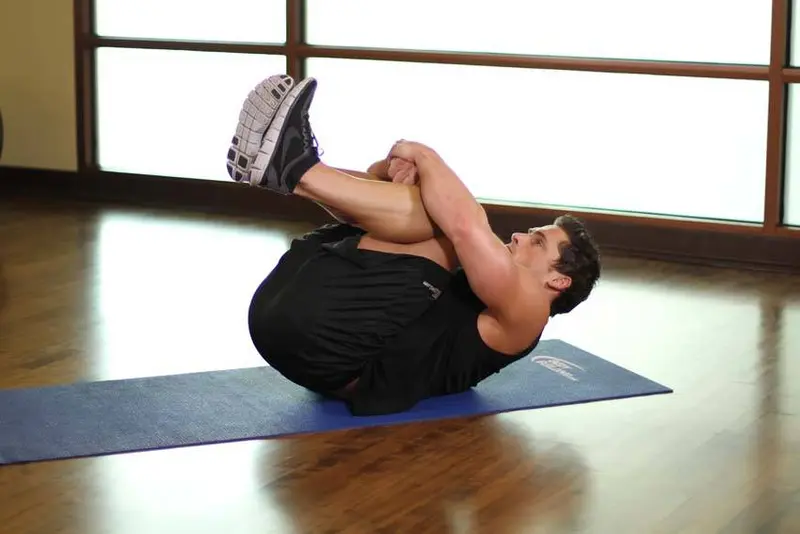 Hug Knees To Chest — finish position