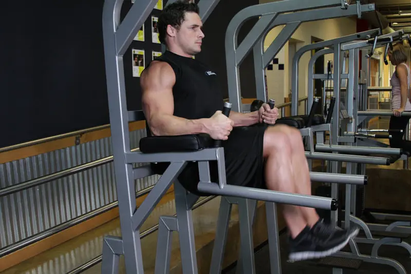 Knee/Hip Raise On Parallel Bars — finish position