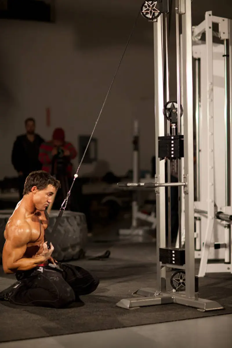 Kneeling Single-Arm High Pulley Row — finish position