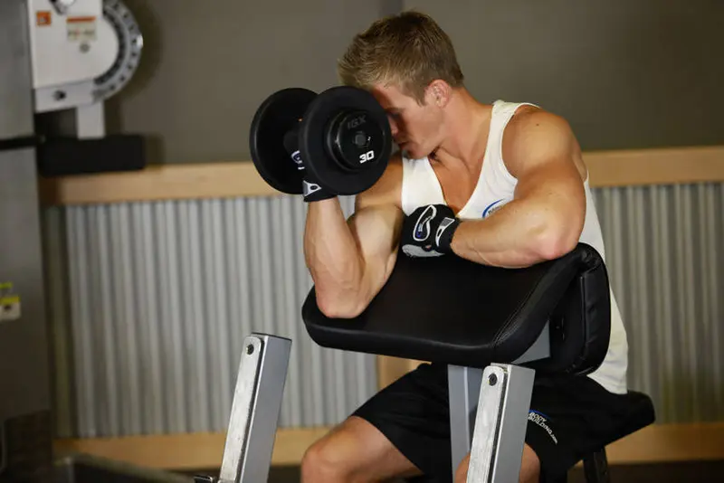 One Arm Dumbbell Preacher Curl — finish position