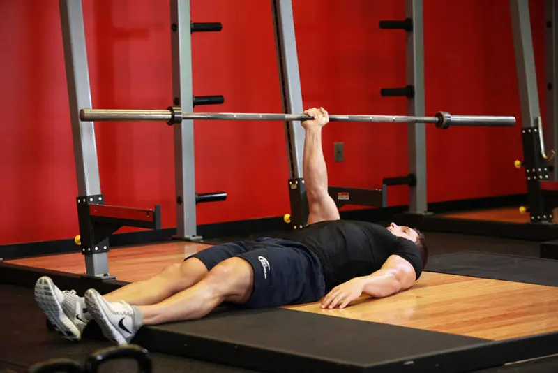 One Arm Floor Press — finish position