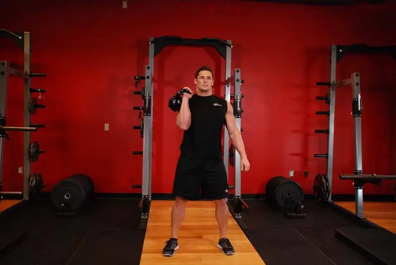 One-Arm Kettlebell Clean and Jerk — finish position