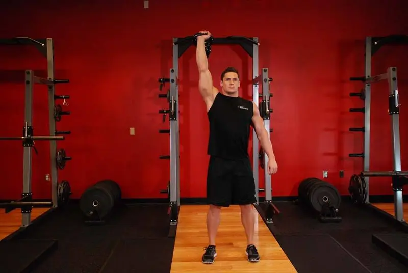 One-Arm Kettlebell Para Press — finish position