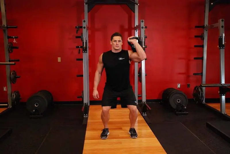 One-Arm Kettlebell Push Press — finish position