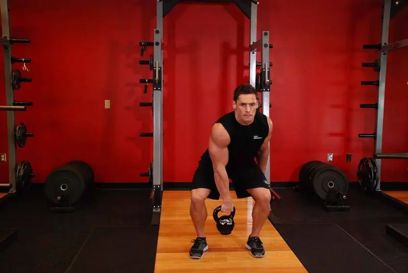 One-Arm Kettlebell Split Snatch — finish position