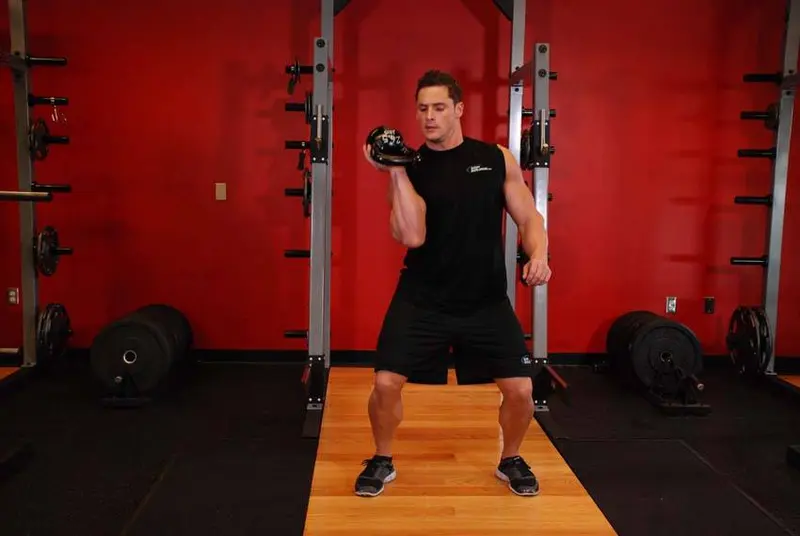 One-Arm Open Palm Kettlebell Clean — finish position
