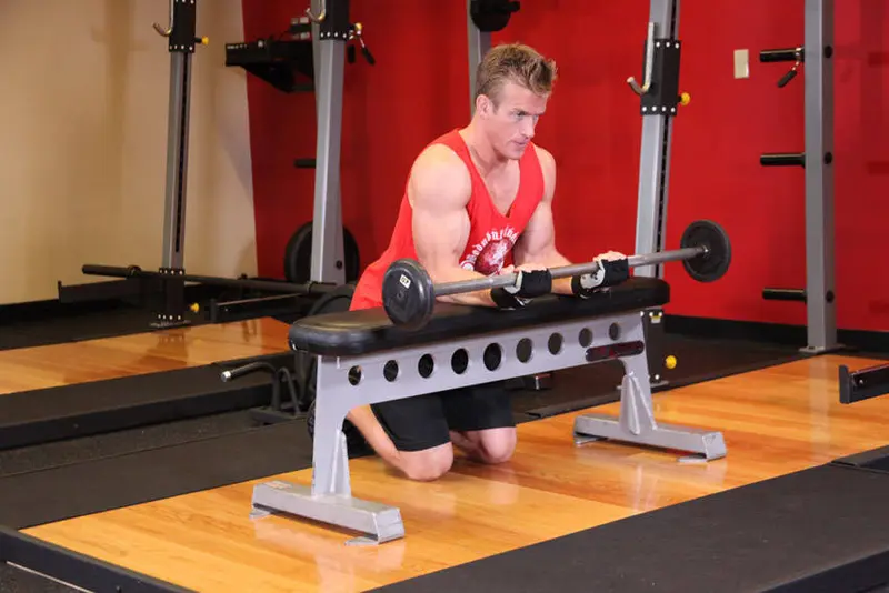 Palms-Up Barbell Wrist Curl Over A Bench — finish position