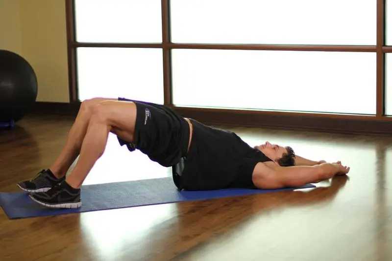 Pelvic Tilt Into Bridge — finish position