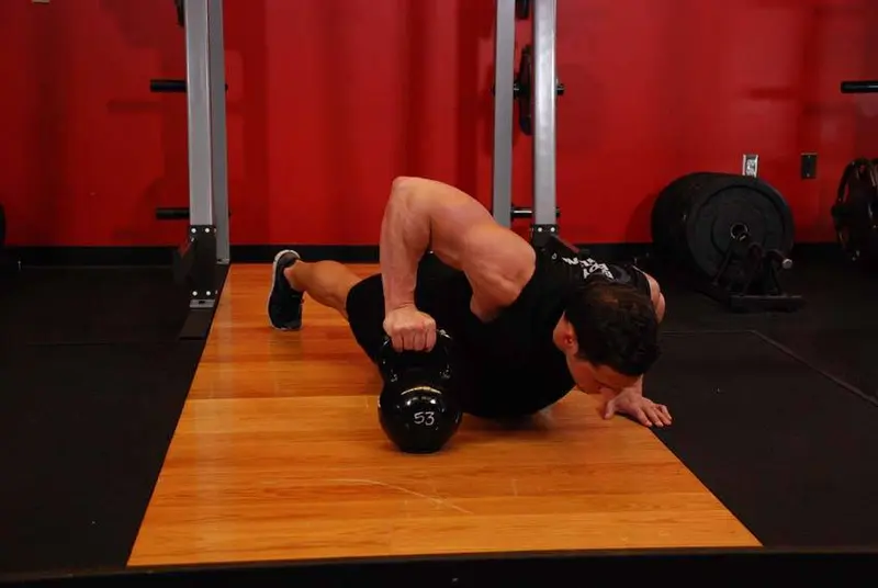 Plyo Kettlebell Pushups — finish position