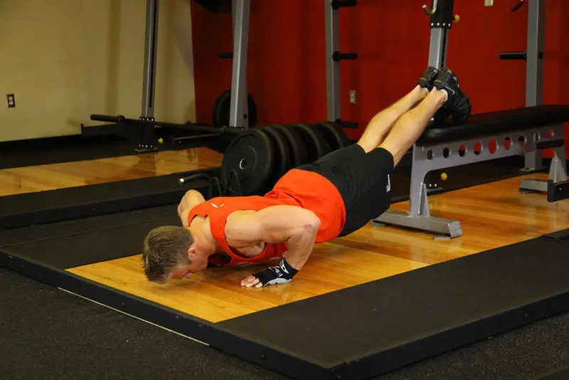 Push-Ups With Feet Elevated — finish position