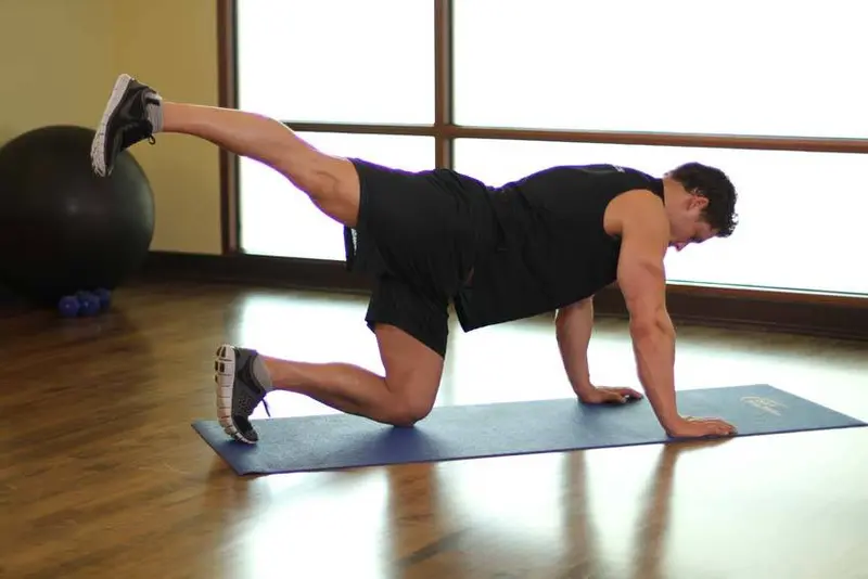 Rear Leg Raises — finish position
