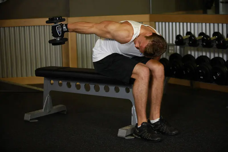 Seated Bent-Over One-Arm Dumbbell Triceps Extension — finish position