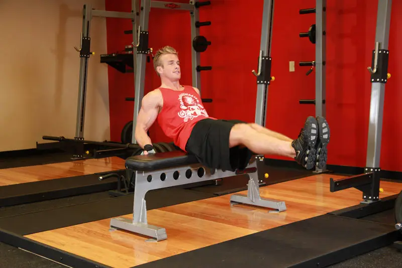 Seated Leg Tucks — finish position