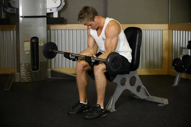 Seated Palm-Up Barbell Wrist Curl — finish position