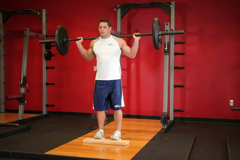 Standing Barbell Calf Raise — finish position