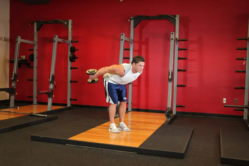 Standing Bent-Over Two-Arm Dumbbell Triceps Extension — finish position