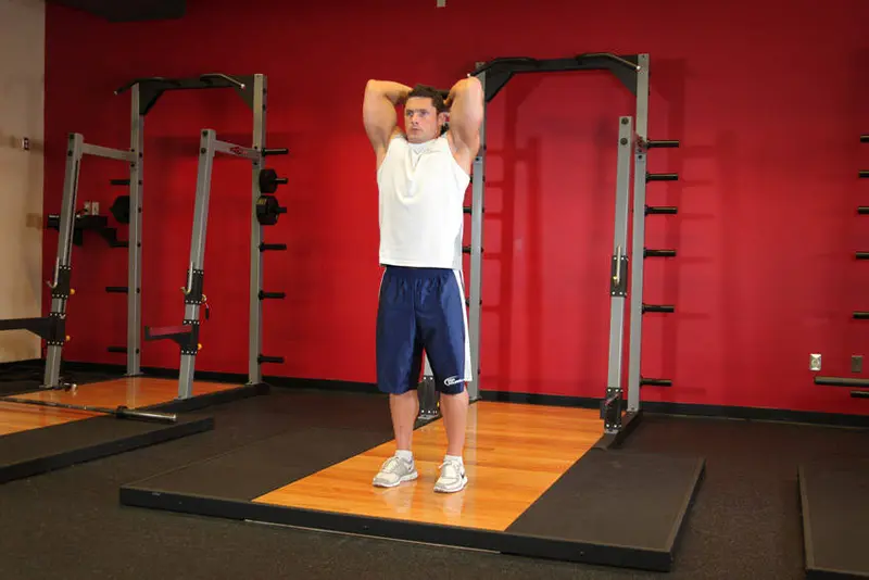 Standing Dumbbell Triceps Extension — finish position