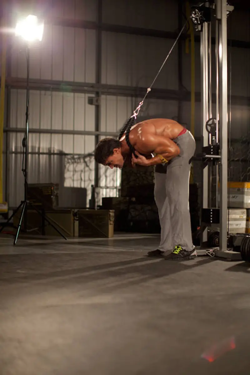 Standing Rope Crunch — finish position