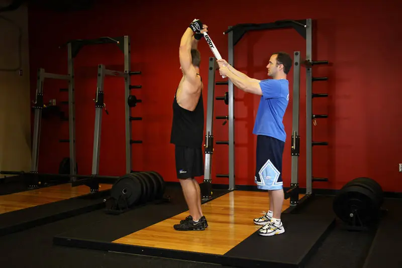 Standing Towel Triceps Extension — finish position