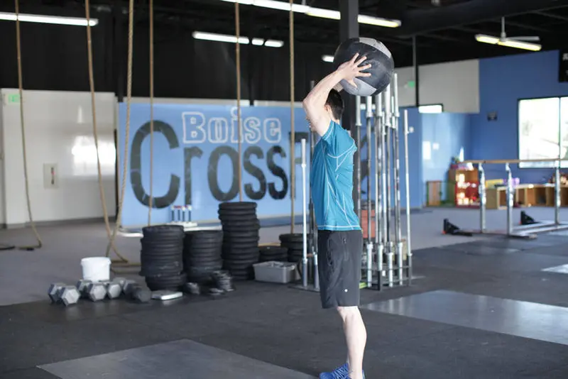 Standing Two-Arm Overhead Throw — finish position
