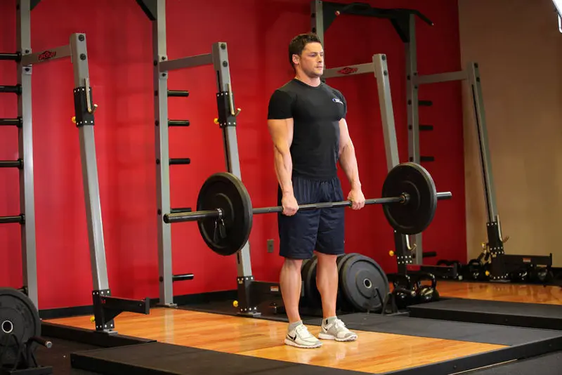 Stiff-Legged Barbell Deadlift — finish position