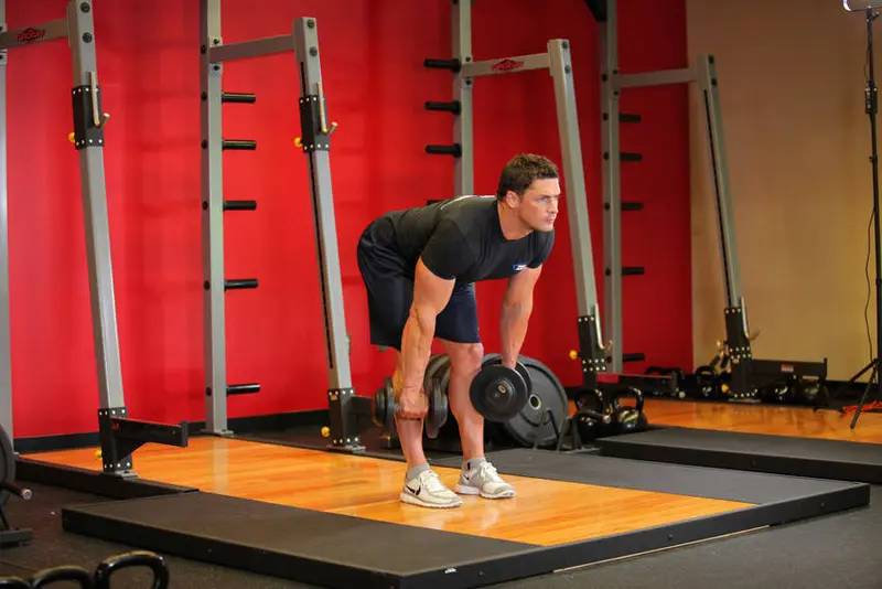 Stiff-Legged Dumbbell Deadlift — finish position