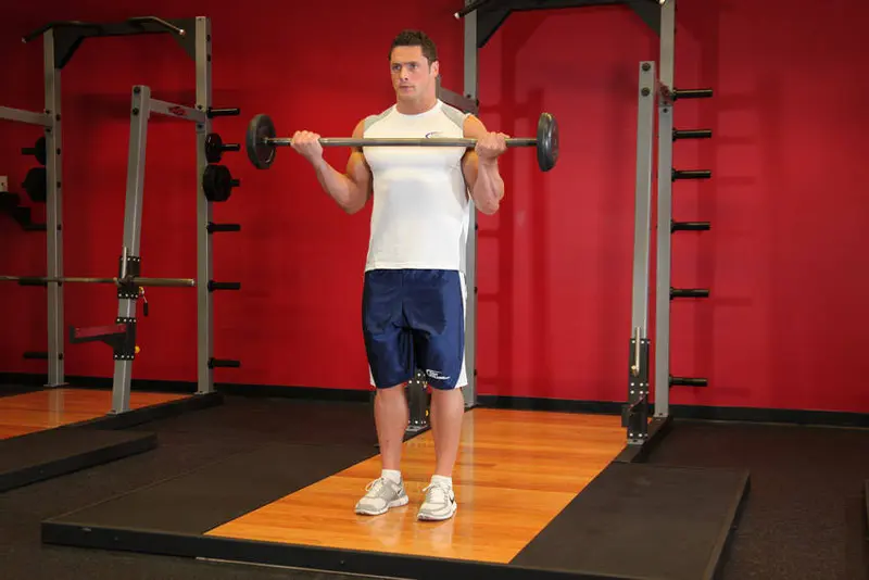 Wide-Grip Standing Barbell Curl — finish position